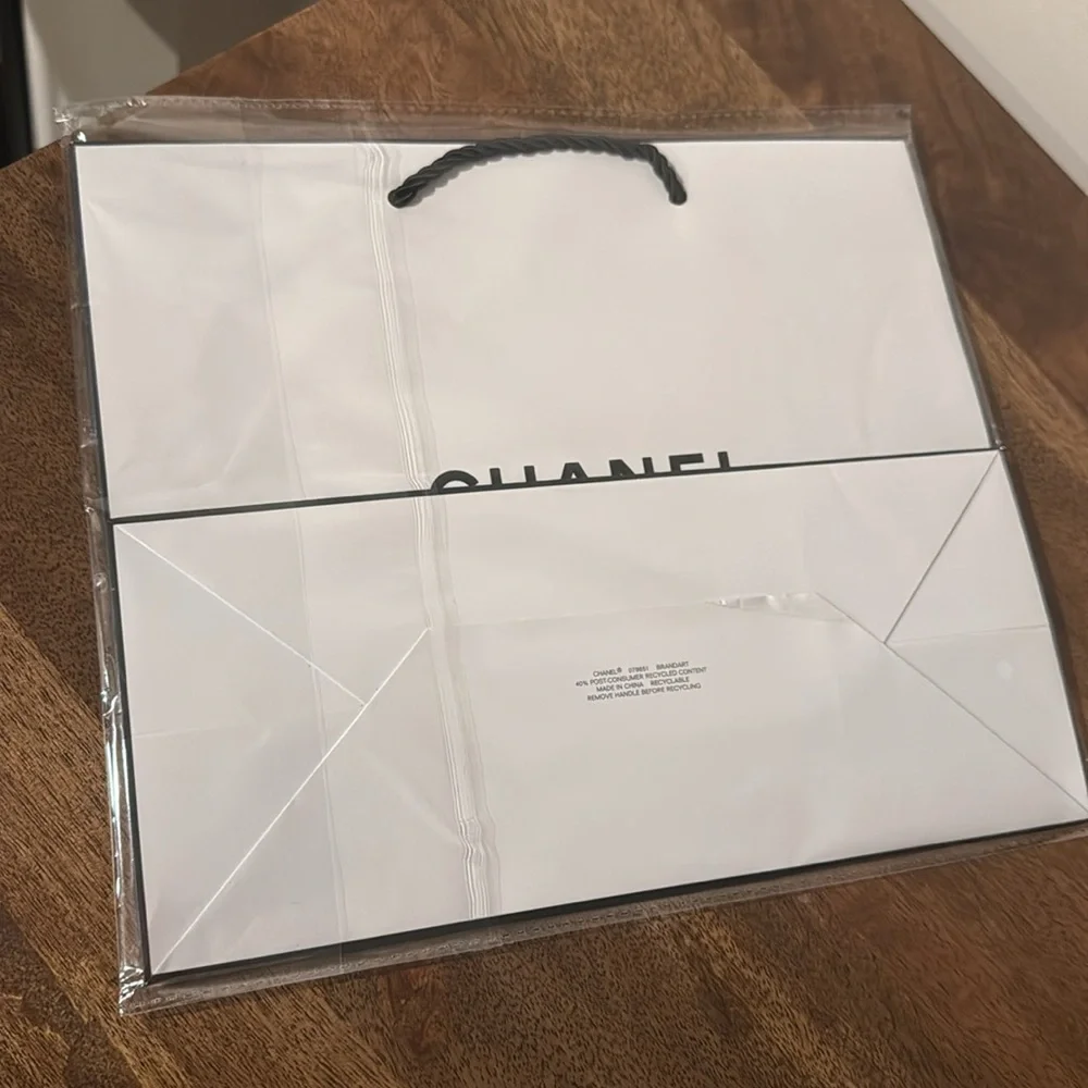 Authentic CHANEL gift bag. 10.5 x 9 x 4.5 in. White with logo in black